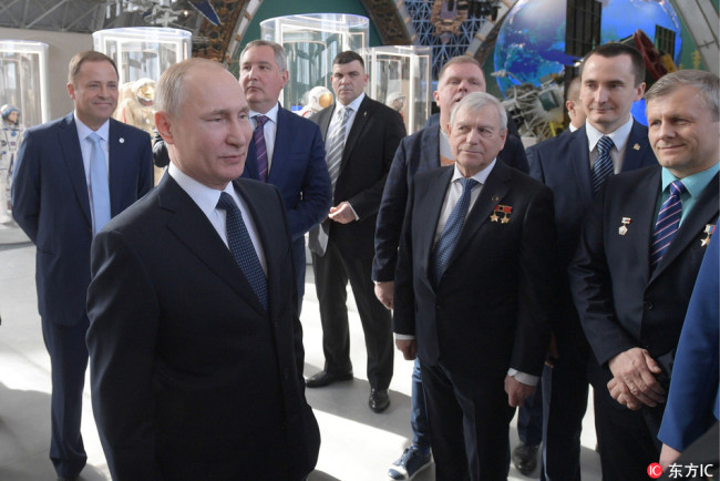 Russia's President Vladimir Putin (L front) visits the renovated Cosmos pavilion of the VDNKh exhibition centre. [Photo: IC]