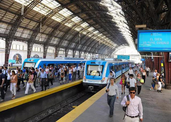 An undated photo shows people departing a Chinese-produced metro train in Buenos Aires, capital city of Argentina. [Photo: CRRC]