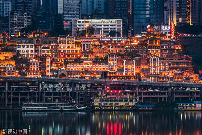 A night view of the Hongya Cave in Chongqing. [File Photo: VCG]