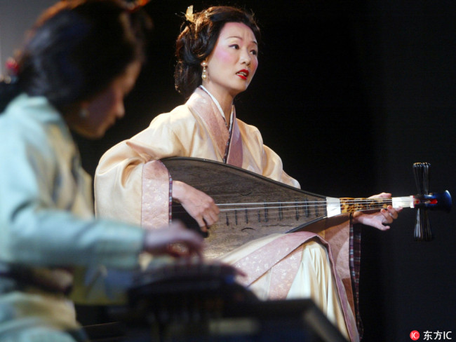 Dressed in traditional costume, Chinese musicians perform Nanguan, the oldest exiciting classical music in China.[Photo:IC]