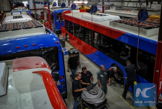 File photo taken on Sept. 23, 2016 shows people working at a BYD electric vehicle plant in Lancaster, California, the United States.[Photo: Xinhua/Zhang Chaoqun]