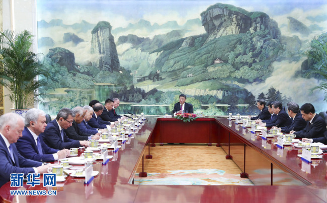 Chinese President Xi Jinping (center) meets with heads of foreign delegations attending the 13th meeting of Security Council Secretaries of the Shanghai Cooperation Organization (SCO) in Beijing on May 22 2018. [Photo: Xinhua]