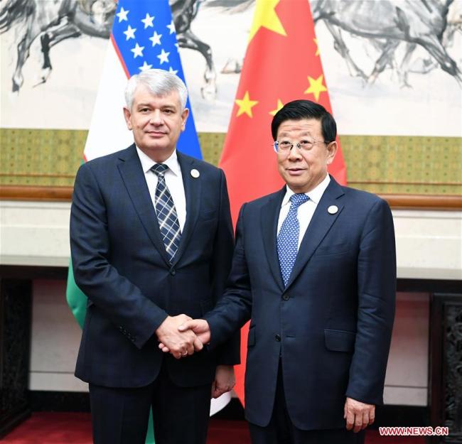 Chinese State Councilor and Minister of Public Security Zhao Kezhi (R) meets with Secretary of the Security Council of Uzbekistan Viktor Makhmudov, who is also head of a delegation attending the 13th meeting of Shanghai Cooperation Organization (SCO) Security Council Secretaries, in Beijing, capital of China, May 21, 2018. [Photo: Xinhua]