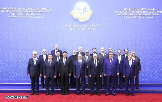 Chinese President Xi Jinping (3rd L, front) and other leaders and representatives of international and regional organizations pose for a group photo before a large-range meeting of the 17th meeting of Council of Heads of State of the Shanghai Cooperation Organization (SCO) in Astana, Kazakhstan, June 9, 2017.[Photo: Xinhua]