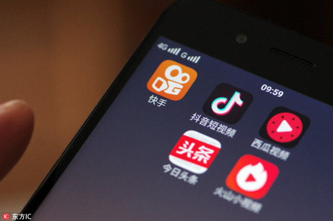 Mobile video apps including Kuaishou, Douyin, Xigua and Huoshan are displayed on the screen of a 4G smartphone.[File photo: IC]