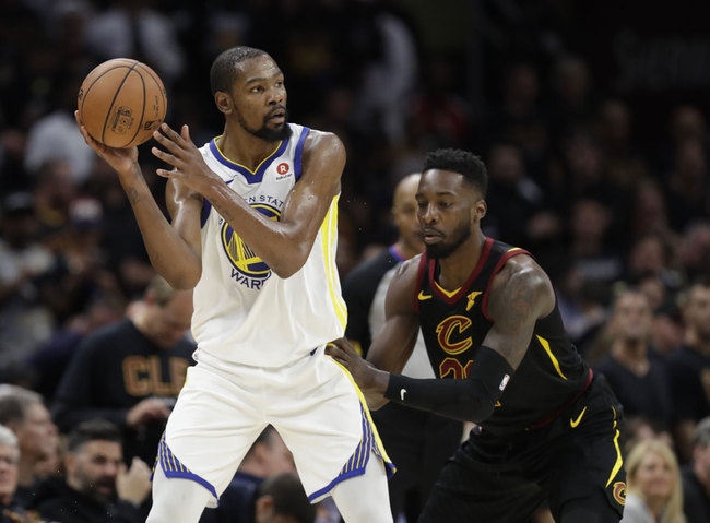 Golden State Warriors' Kevin Durant is defended by Cleveland Cavaliers forward Jeff Green (32) in the second half of Game 3 of basketball's NBA Finals, Wednesday, June 6, 2018, in Cleveland. [Photo: AP]