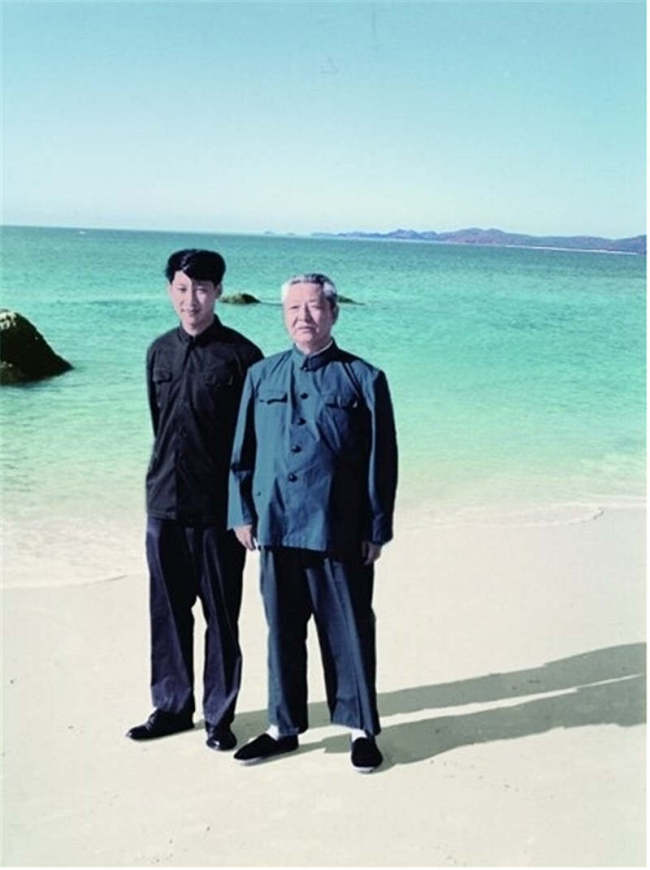 Xi Zhongxun poses for a photo with his son Xi Jinping in south China's Hainan Province in August 1978. [Photo: Photographs of Xi Zhongxun]