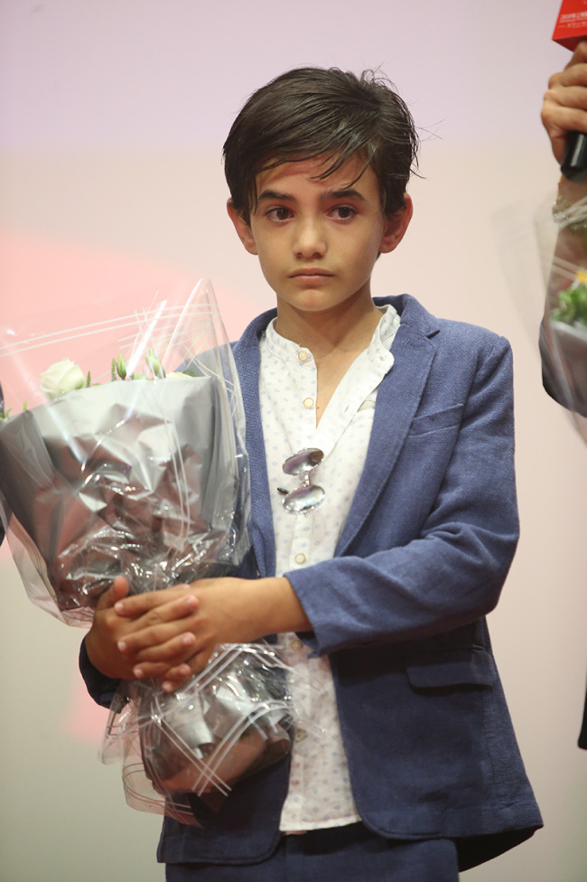 Child actor Zain Alrafeea attends a promotional event in Shanghai ahead of the premiere of 'Capharnaum' in China on June 17, 2018. [Photo: China Plus]