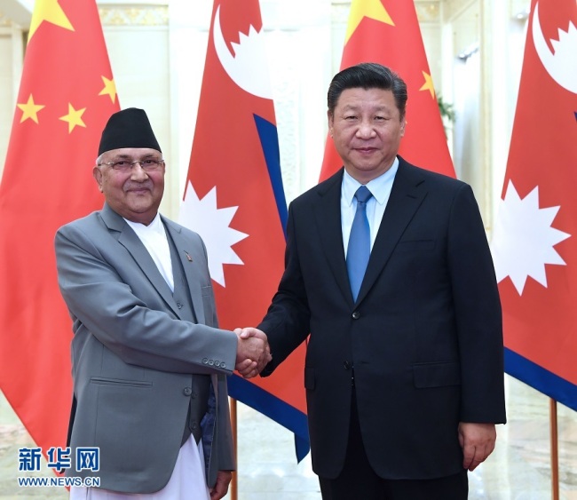 Chinese President Xi Jinping meets with Nepal's Prime Minister K.P. Sharma Oli in Beijing on Wednesday, June 20, 2018. [Photo: Xinhua]