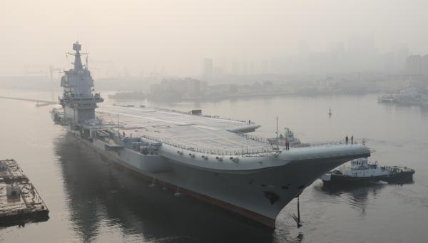China's first domestically built aircraft carrier sets out to sea near the Dalian Shipyard in Liaoning province on May 13, 2018 for its first sea trial. [Photo: people.cn]