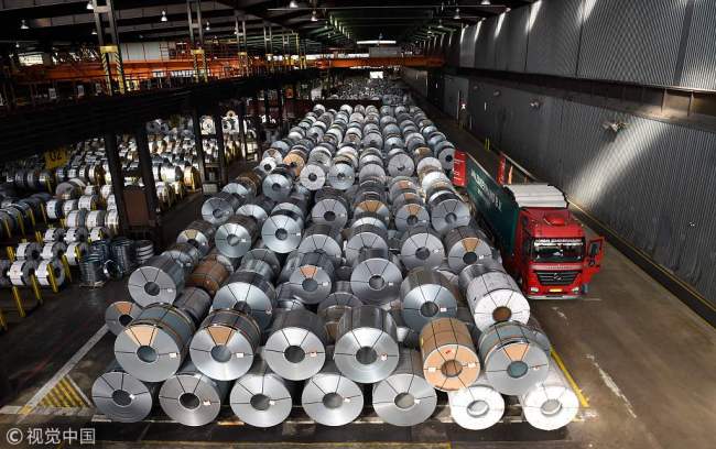 In this file photo taken on March 17, 2015, coils are stored for delivery at the production site of German steel technology group Salzgitter AG in Salzgitter. [File Photo: VCG]