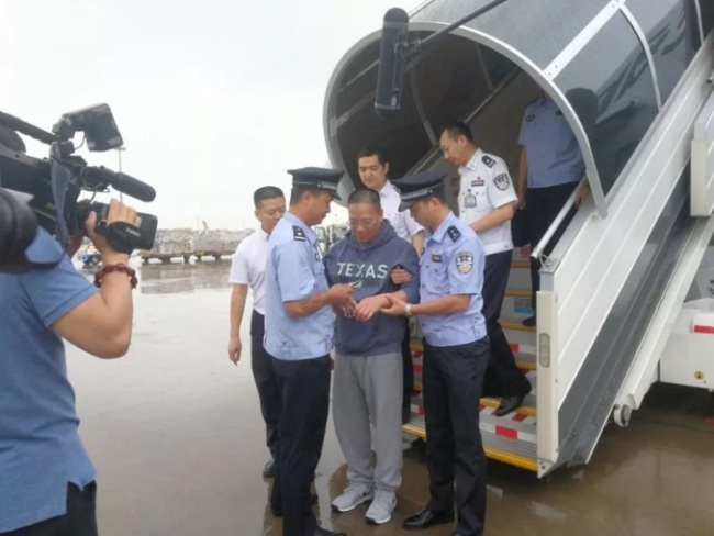 Xu Chaofan is repatriated from the United States back to China. [Photo: CCTV]