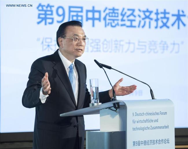 Chinese Premier Li Keqiang speaks at the closing ceremony of a forum on economic and technological cooperation in Berlin, Germany, July 9, 2018. German Chancellor Angela Merkel also attended the event. [Photo: Xinhua/Li Tao]