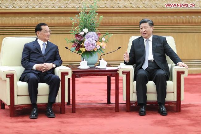 Xi Jinping (R), general secretary of the Communist Party of China (CPC) Central Committee, meets a delegation of people from various sectors in Taiwan, led by former chairman of the Kuomintang (KMT) party Lien Chan (L), at the Great Hall of the People in Beijing, capital of China, July 13, 2018. [Photo: Xinhua/Ju Peng]