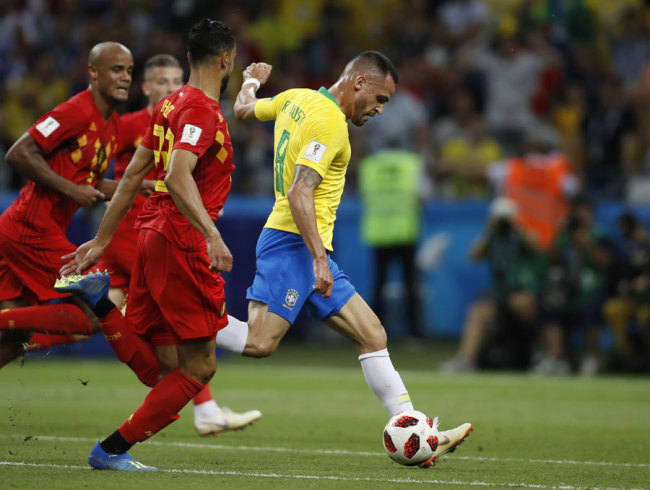 Brazil's Renato Augusto shoots on the goal during the quarterfinal match between Brazil and Belgium at the 2018 soccer World Cup in the Kazan Arena, in Kazan, Russia, Friday, July 6, 2018. [Photo: AP/Francisco Seco]