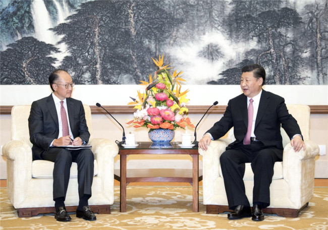 Chinese President Xi Jinping (R) meets with World Bank President Jim Yong Kim in Beijing on Monday, July 16, 2018. [Photo: Xinhua]