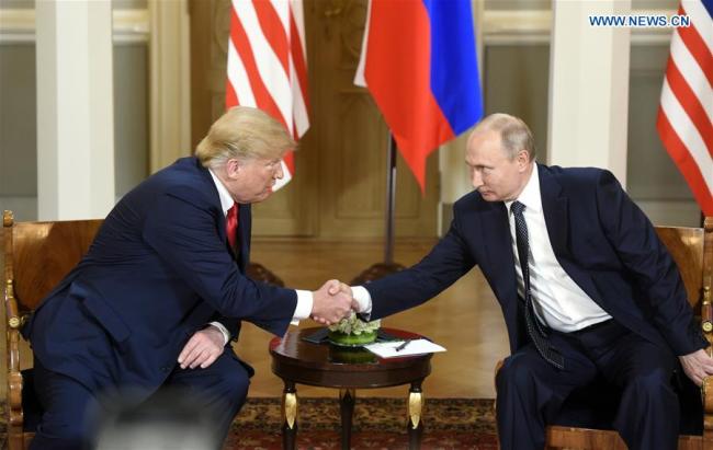 U.S. President Donald Trump (L) shakes hands with his Russian counterpart Vladimir Putin in Helsinki, Finland, on July 16, 2018. U.S. President Donald Trump and his Russian counterpart Vladimir Putin started their first bilateral meeting here on Monday, and they are expected to discuss a wide range of issues. [Photo: Xinhua]