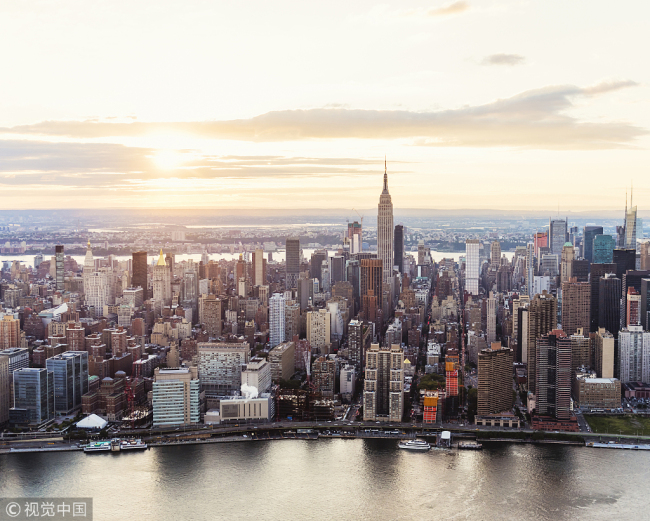 Aerial view of New York City skyline and sunset, New York, United States. [Photo：VCG]