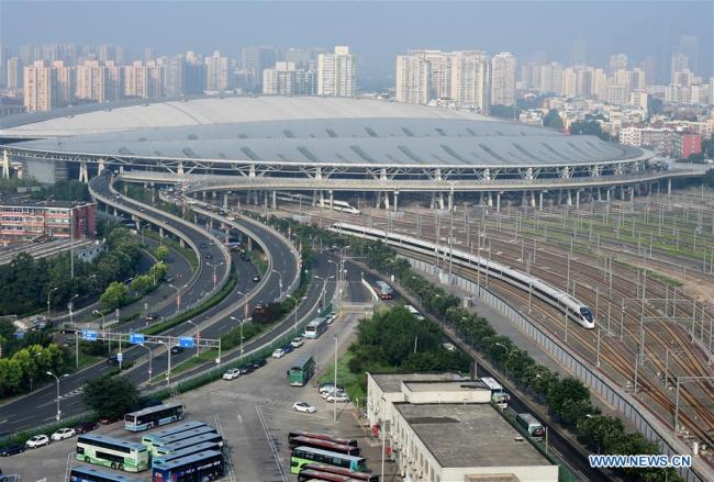 A Beijing-Tianjin high-speed intercity train departs(驶离) the Beijing South Railway Station in Beijing, capital of China, Aug. 1, 2018. (Xinhua/Luo Xiaoguang)