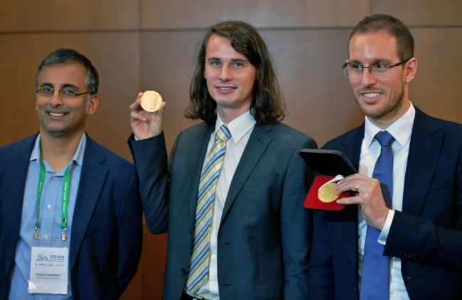 (L to R) Indian Australian mathematician, Akshay Venkatesh, German mathematician Peter Scholze, and Italian mathematician Alessio Figalli, three of four winners of mathematics' prestigious Fields medal, often known as the Nobel prize for math pose at the International Congress of Mathematicians in Rio de Janeiro, Brazil on August 01, 2018. A Kurdish refugee turned Cambridge University professor who was awarded math's most prestigious prize in Rio de Janeiro on Wednesday had the gold medal stolen from him just minutes later, organizers said. [Photo: AFP/Carl de Souza]