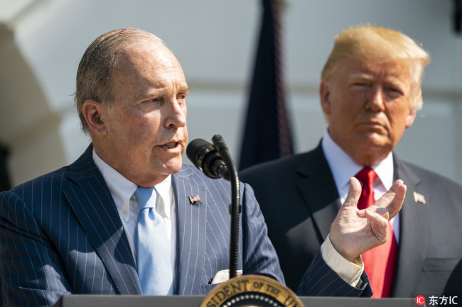US President Donald J. Trump (R) listens to Larry Kudlow, Director of the National Economic Council, make remarks on the economy on the South Lawn of the White House in Washington, DC, USA, July 27, 2018.  [Photo: IC]