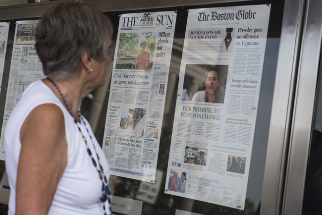 The front page of the Boston Globe August 16, 2018 edition is on display outside the Newseum in Washington DC on August 16,2018. US newspapers big and small hit back Thursday at Donald Trump's relentless attacks on the news media with a coordinated campaign of editorials, triggering a fresh tirade from the president on Twitter. Leading the charge was The Boston Globe, which had called for the drive highlighting the importance of a free press, accompanied by the hashtag #EnemyOfNone.[Photo: AFP/Eric BARADAT]