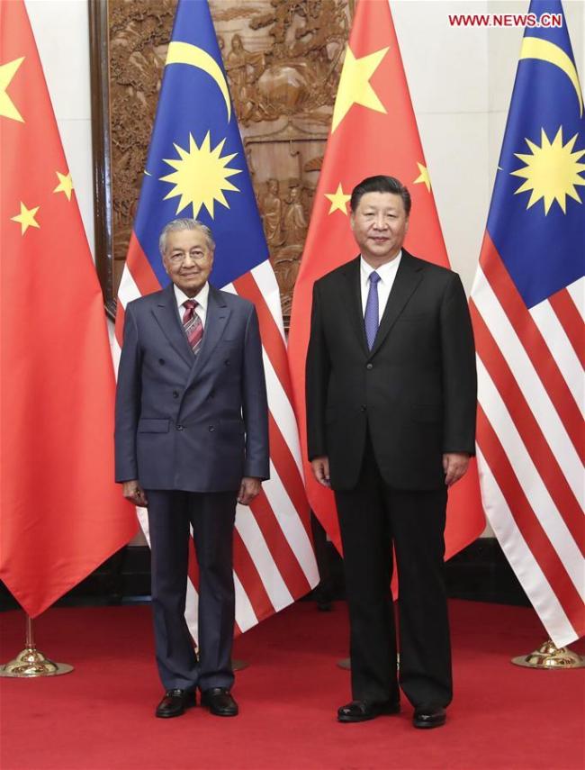 Chinese President Xi Jinping (R) meets with Malaysian Prime Minister Mahathir Mohamad in Beijing, capital of China, Aug. 20, 2018. [Photo: Xinhua/Pang Xinglei]