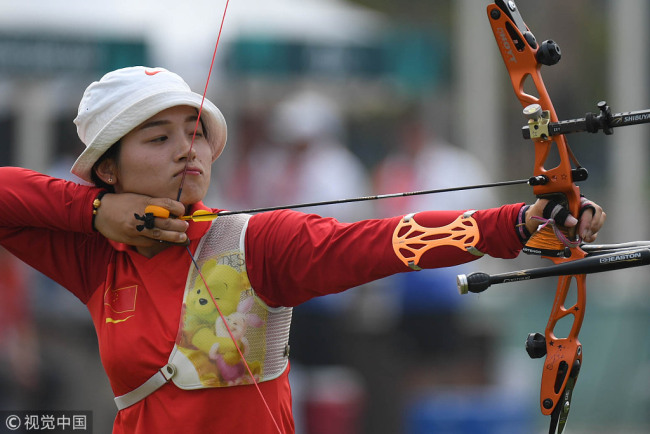 Zhang Xinyan of China in action during Archery Recurve Women's Team Quarterfinal between China and Kazakhstan on day seven of the Asian Games on August 25, 2018 in Jakarta, Indonesia. [Photo: VCG]