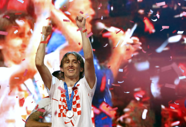 Luka Modric celebrates upon arrival in Zagreb, Croatia, Monday, July 16, 2018. [Photo: AP]