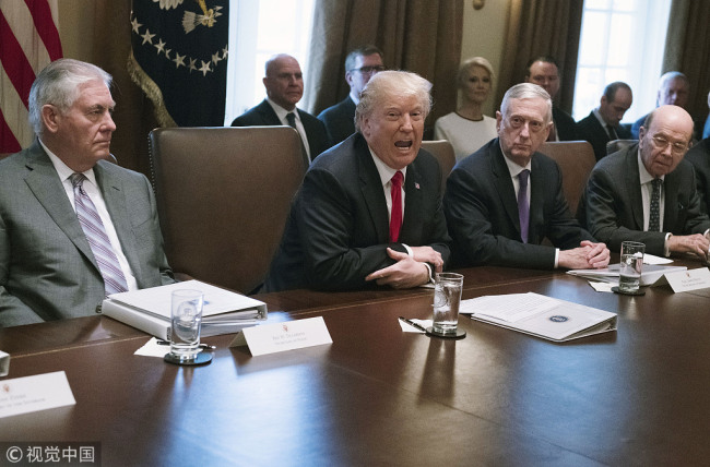U.S. President Donald Trump, center, speaks while Rex Tillerson, U.S. Secretary of State, left, Jim Mattis, U.S. Secretary of Defense, second right, and Wilbur Ross, U.S. commerce secretary, listen during a cabinet meeting at the White House in Washington, D.C., U.S., on Wednesday, Jan. 10, 2018. [Photo: IC]