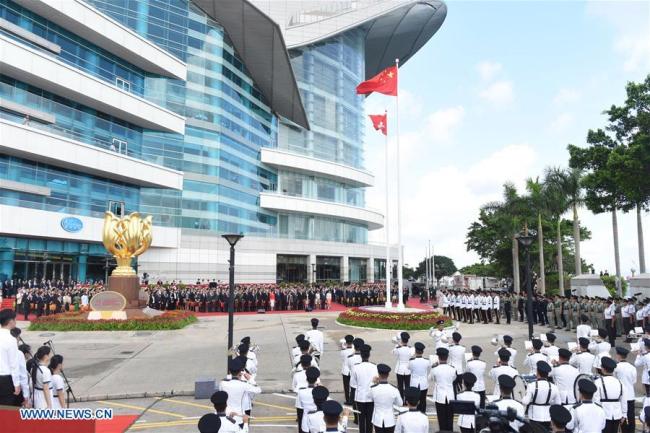 A flag-raising ceremony is held at Golden Bauhinia Square to celebrate the 21st anniversary of Hong Kong's return to the motherland, in Hong Kong, south China, July 1, 2018. [File photo: Xinhua]
