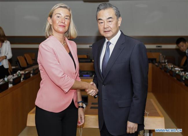 Chinese State Councilor and Foreign Minister Wang Yi (R) shakes hands with European Union foreign and security policy chief Federica Mogherini during their meeting at the UN headquarters in New York, on Sept. 27, 2018. [Photo: Xinhua]