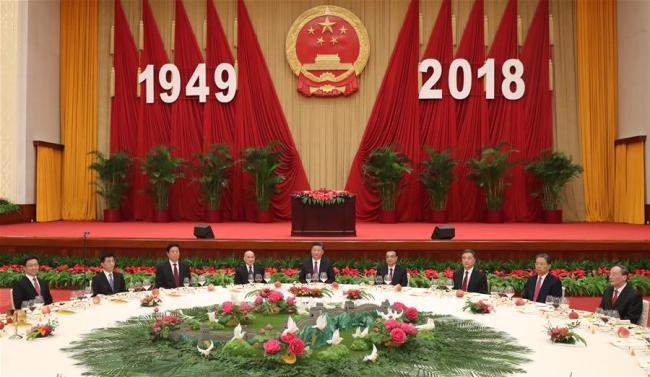 Leaders of the Communist Party of China and the state Xi Jinping (C), Li Keqiang (4th R), Li Zhanshu (3rd L), Wang Yang (3rd R), Wang Huning (2nd L), Zhao Leji (2nd R), Han Zheng (1st L) and Wang Qishan (1st R) attend a reception celebrating the 69th anniversary of the founding of the People's Republic of China in Beijing, capital of China, on Sept. 30, 2018. [Photo: Xinhua/Liu Weibing]