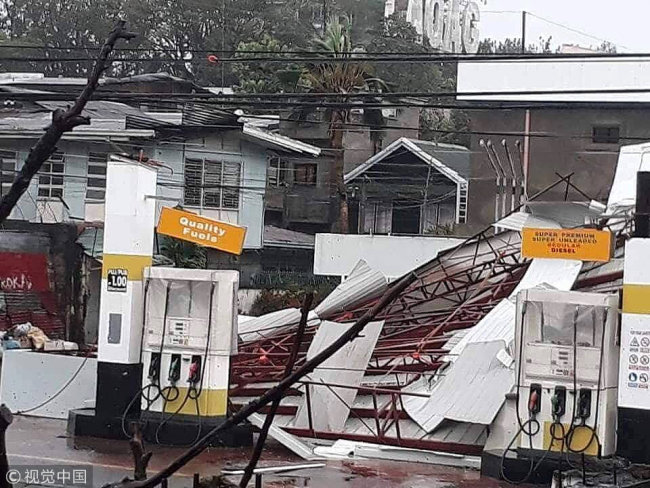 A damaged petrol station is seen as Typhoon Mangkhut hits Philippines, Laoag, Philippines September 15, 2018 in this still image obtained from a social media video.[File Photo: VCG]