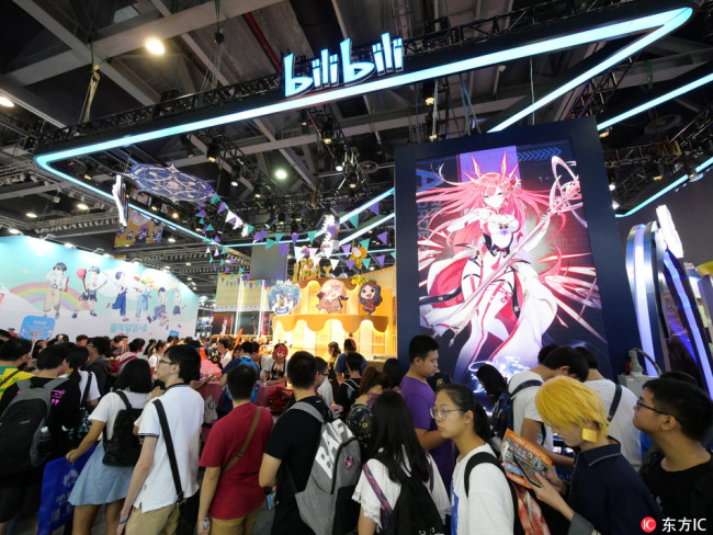 People visit the stand of Bilibili, a leading Chinese video-sharing streaming website, during an exhibition in Guangzhou, Guangdong, 1 October 2018. [File photo: IC]