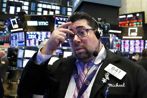 Trader Michael Capolino works on the floor of the New York Stock Exchange, Thursday, Oct. 11, 2018. [Photo: AP]