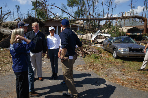 FEMA director Brock Long, right, talks with from left, Homeland Security Secretary Kirstjen Nielsen, Florida Gov. Rick Scott, President Donald Trump, first lady Melania Trump and Margo Anderson, Mayor of Lynn Haven, Fla., second from right, as they tour a neighborhood affected by Hurricane Michael, Monday, Oct. 15, 2018, in Lynn Haven, Fla. [Photo: AP/Evan Vucci]