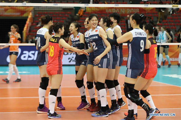 Players of China celebrate after winning the Pool H match against the Netherlands at the 2018 Volleyball Women's World Championship in Nagoya, Japan, October 16, 2018. China won 3-1. [Photo: Xinhua/Du Xiaoyi]