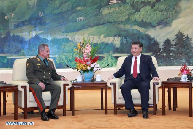 Chinese President Xi Jinping (R) meets with visiting Russian Defense Minister Sergei Shoiguat at the Great Hall of the People in Beijing, capital of China, on Friday, October 19, 2018. [Photo: Xinhua]