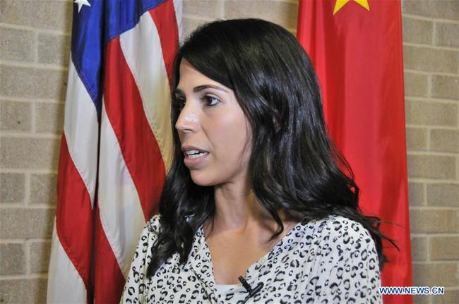 Triana Gonzalez Valdez, director of the Office of International Engagement at Texas A&M International University (TAMIU), receives an interview with Xinhua in Laredo, Texas, the United States, on Sept. 20, 2018. [Photo: Xinhua]