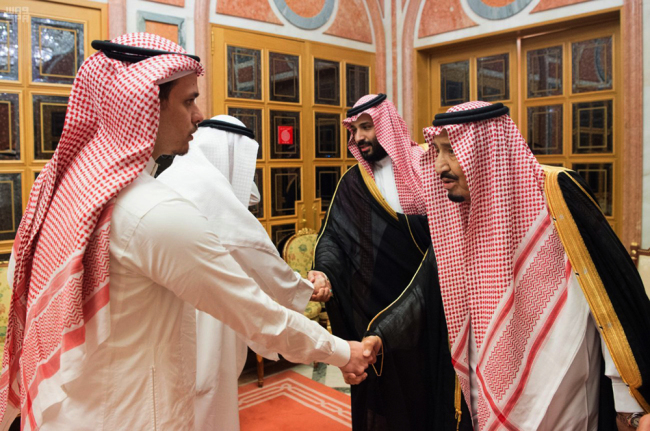 Saudi King Salman, right, and Crown Prince Mohammed bin Salman, second right, receive Sahel, a family member, and Salah, a son, of Jamal Khashoggi, in Riyadh, Saudi Arabia, Tuesday, Oct. 23, 2018. [Photo: AP]