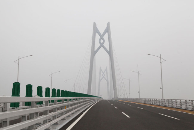 Photo taken on October 10, 2018 shows the bridge towers of the Hong Kong-Zhuhai-Macao Bridge in Guangdong Province. The world's longest sea bridge will be officially put into service on Wednesday, October 24, 2018. [Photo: China Plus/Zhang Jin]