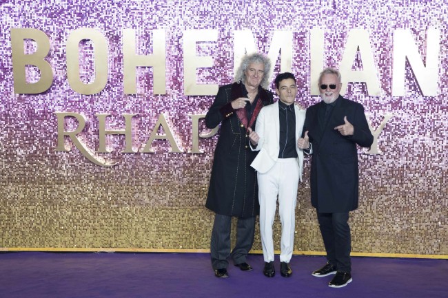 Queen band member Brian May, from left, actor Rami Malek and Queen band member Roger Taylor of Queen pose for photographers upon arrival at the World premiere of the film 'Bohemian Rhapsody' in London, Tuesday, Oct. 23, 2018. [Photo：AP] 