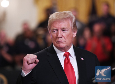 U.S. President Donald Trump makes a gesture during the Pledge to America's Workers event at the White House in Washington, D.C., the United States, on July 19, 2018. [Photo: Xinhua/Liu Jie]