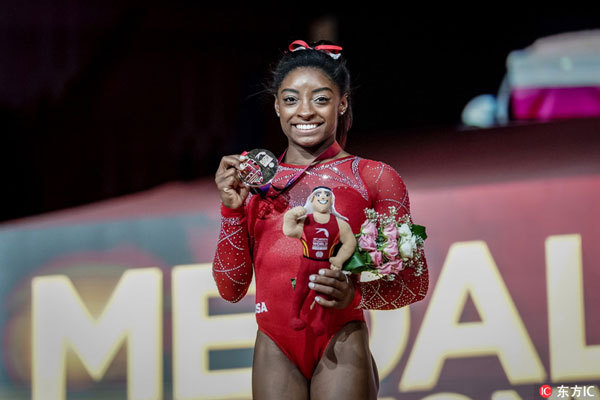 Simone Biles of United States with her gold for Floor at the Aspire Dome in Doha, Qatar at the Artistic FIG Gymnastics World Championships on November 3, 2018. [Photo: Imagine China]