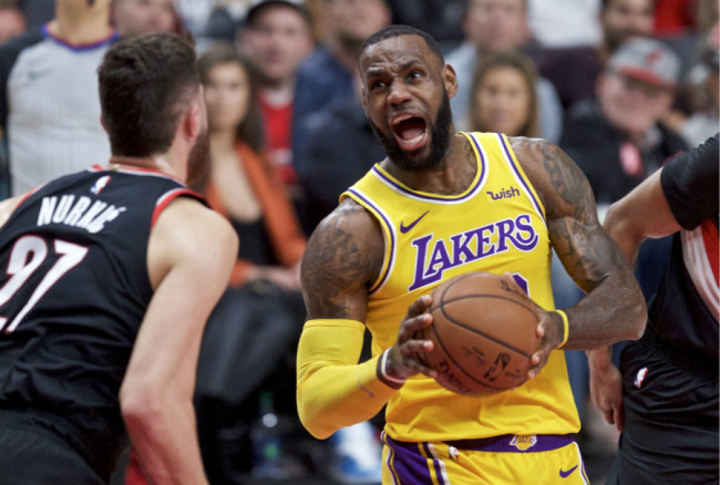 Los Angeles Lakers forward LeBron James, right, drives to the basket towards Portland Trail Blazers center Jusuf Nurkic during the first half of an NBA basketball game in Portland, Ore., Saturday, Nov. 3, 2018. [Photo: AP]