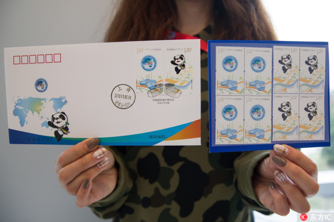 Photo taken on November 5, 2018, shows a set of commemorative stamps, along with an envelope, marking the launch of the first-ever China International Import Expo (CIIE) in Shanghai. [Photo: IC]