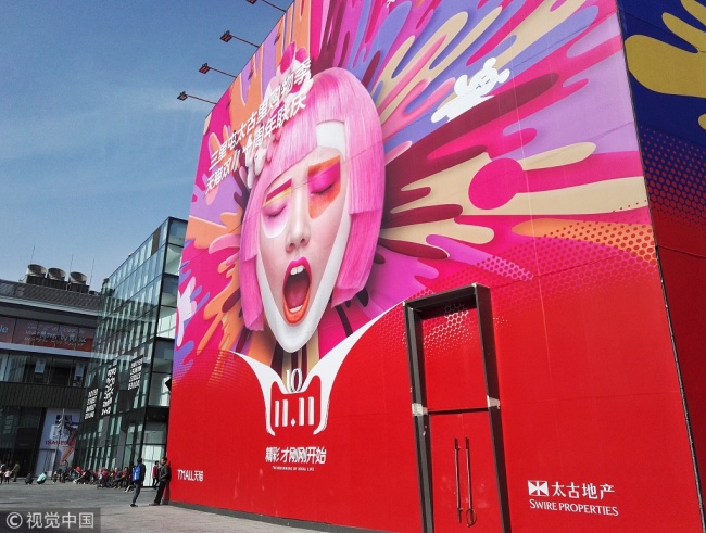 A huge poster of 11.11 in Sanlitun, one of the busiest commercial areas in Beijing. [Photo: VCG]