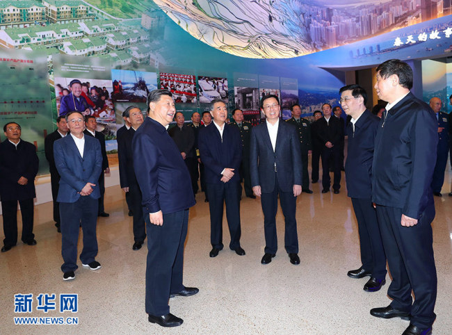 Chinese President Xi Jinping visits a major exhibition to commemorate the 40th anniversary of China's reform and opening-up at the National Museum of China in Beijing on Tuesday, November 13, 2018. [Photo: Xinhua]