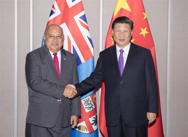 Chinese President Xi Jinping (R) meets with Fiji Defense Minister Ratu Inoke Kubuabola, who also serves as the representative of the Fiji government, in Port Moresby, Papua New Guinea, on Nov. 16, 2018. [Photo: Xinhua/Huang Jingwen]